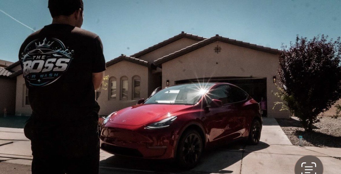 The Boss with a freshly detailed Tesla